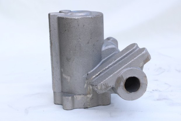 As-cast iron body with cored internal passages before machining
