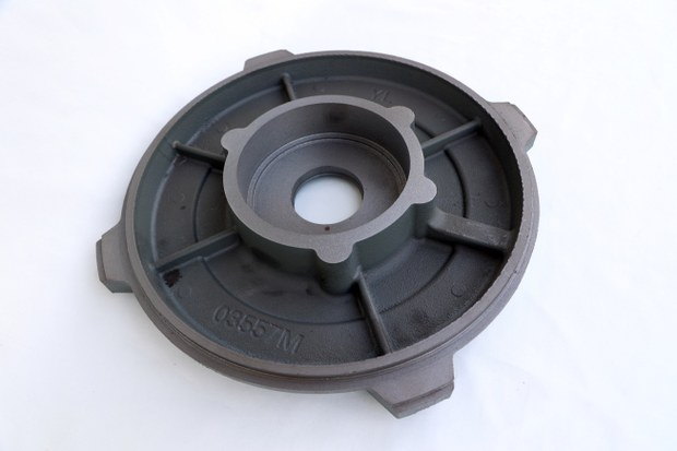 Spoked round end cover casting with a machined centre bore